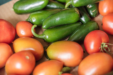 Fresh red organic tomatoes and habaneros, all good for a healthy juicy vegetarian salad