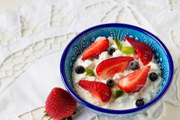 Fresh berries, strawberries with cottage cheese for breakfast.