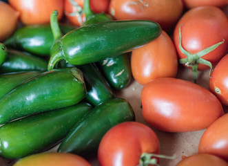 Fresh red organic tomatoes and habaneros, all good for a healthy juicy vegetarian salad