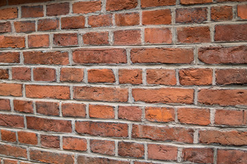 Fototapeta premium Background/Wallpaper/Textures - Orange and yellow bricks in a brick wall.