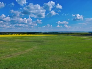 green field and blue sky in Minsk Region of Belarus