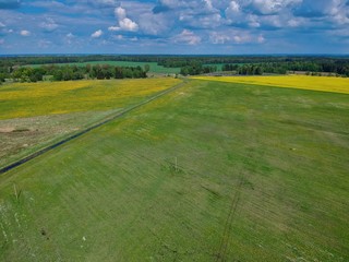 Aerial view of green field  in Minsk Region of Belarus