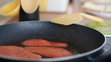 Three smoking hot rations of Quorn veggie & vegan bacon, sizzling in a hot frying pan full of sizzling oil, a great breakfast supplement for national vegetarian week.