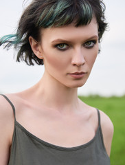 Outdoor close-up portrait of beautiful young girl