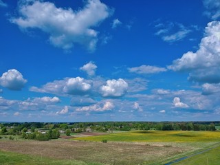 Naklejka premium Aerial view of green field in Minsk Region of Belarus