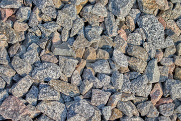 many large stones for cargo on the railroad