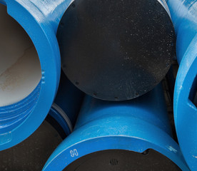 Stack of new blue pipes (tubes)