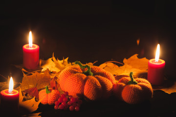 Knitted amigurumi pumpkins and bats on Halloween