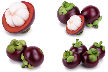 ripe mangosteen with leaves isolated on white background closeup. Set or collection