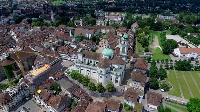 wide aerial shot of the historical cathedral in the village Solothurn in Switzerland. Half-timbered wooden house are typical for this location
