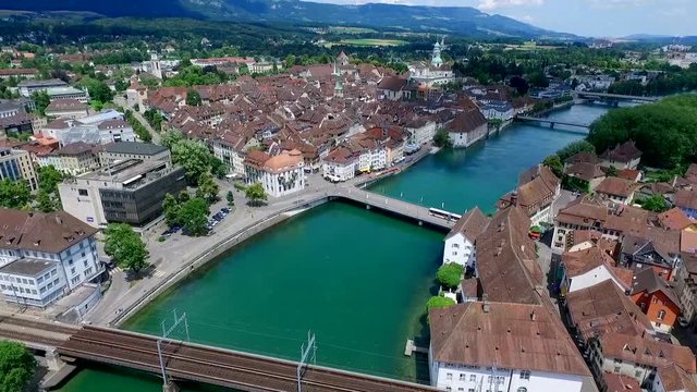 aerial up moving shot of the Aare river which flows through the small village Solothurn in Switzerland.