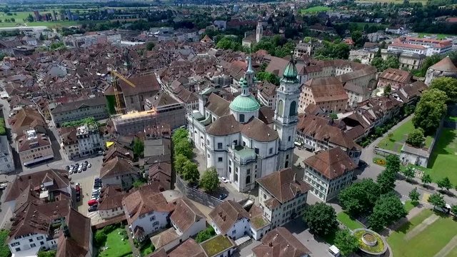 wide aerial shot of the famous cathedral in the small village Solothurn in Switzerland. Half-timbered wooden house are typical for this location