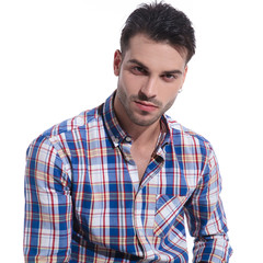 Fototapeta premium Handsome guy romantically looking at the camera
