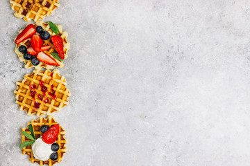 Traditional belgian waffles with fresh berries