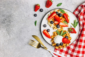 Traditional belgian waffles with fresh berries