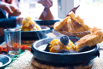 tajine with meat plum almond and sesame seeds. Marocco