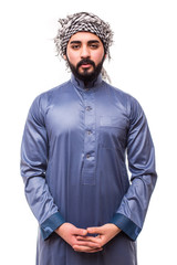 Young arab man wearing in traditional abaya clothes isolated on white background