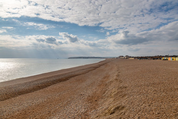 Looking along an empty Seaford beach in Sussex, towards Newhaven