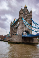 Fototapeta na wymiar The tall tower bridge london with gusty winds