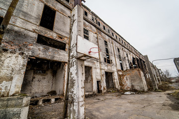 Fototapeta na wymiar Abandoned factory interior. Old industrial building for demolition