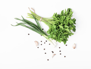Herbs and spices isolated on white background. Parsley, onion, garlic and pepper. Ingredients for cooking. Flat lay. Top view. Minimal food concept.