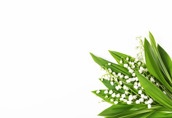 Beautiful bouquet of lilies of the valley isolated on white background. Top view with copy space. Flat lay