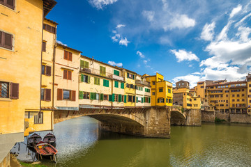Fototapeta na wymiar The Ponte Vecchio, medieval stone old bridge over the Arno River in Florence, Italy.