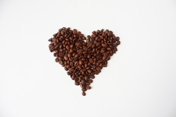 heart made of coffee beans isolated on white