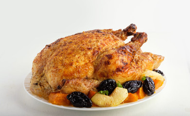 Roast Turkey, chicken, decorated with pumpkins, prunes, apples. thanksgiving day. slow food