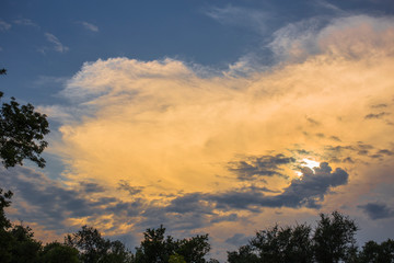 Summer cloudy sky before the rain. The terrain in southern Europe. Sunset over the city. Fantastic view over the planet 