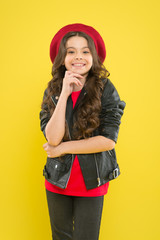 Girl curly hair wear leather jacket. Little rock star concept. Talent contest. Brutal style tender girl. Rock style suits her. Rock and roll is way of life. Outfit ideas every stylish girl should try