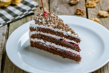 black forest cake on wooden background