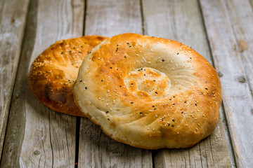 Uzbek bread from tandoor on board