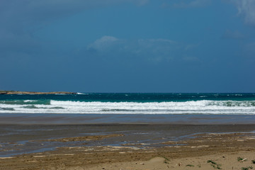 Waves On sand beach of the Aegean Sea in Rhodes.