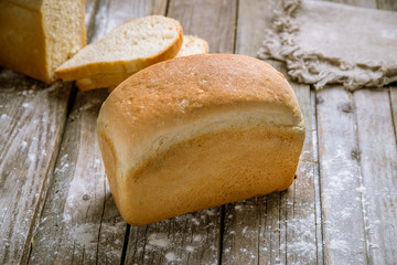 white rectangular bread on wooden background