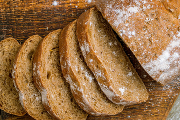 round black bread on wooden background