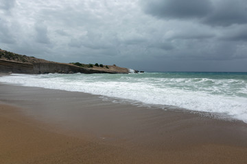 Waves On sand beach of the Aegean Sea in Rhodes.