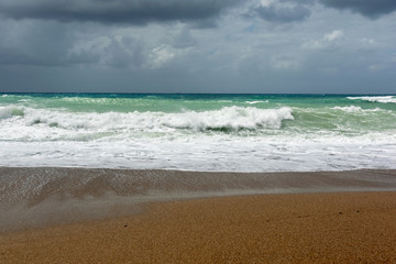 Waves On sand beach of the Aegean Sea in Rhodes.