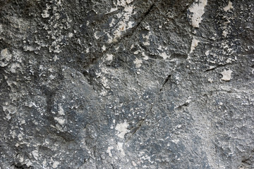 Rough, textured rock surface.
