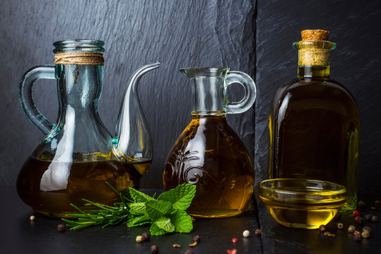 Virgin Olive Oil In A Group Glass Jars And Bolttle