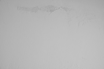 graue verputzte Betonwand mit alten rauen Stellen im oberen Bildbereich. Hintergrund, Textur,...