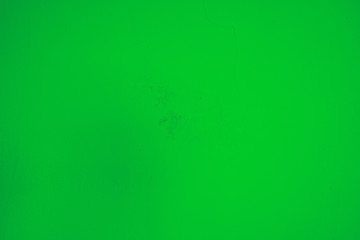 Leuchtend grüner Hintergrund, Steinwand in knalligem grün und leichtem Farbton Verlauf.