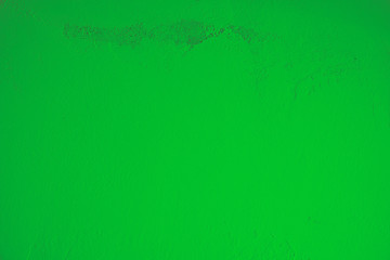 Hell, grün, Pastell, Betonwand mit schmutziger, alter, rauer Struktur im oberen Teil des Bildes. Steinwand, Zementwand im Industrial Style als Hintergrund, Tapete, Gestaltungselement, Kunst