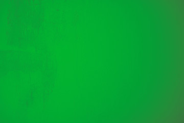 Grüne mit groben Strukturen verputzte Betonwand im Industrial Design. Gestalterisches Element in Pastellfarben als Hintergrund und für Kunstvolle Kollagen. Strukturwand im Hochformat.