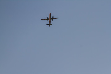Aircraft on a background of cloudy sky. Landing a liner close-up. Spring. Day.