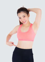 Fototapeta na wymiar beautiful portrait young asian woman in sport clothing pointing waist with satisfied and confident isolated on white background, girl asia have shape and wellness, exercise fit with health concept.