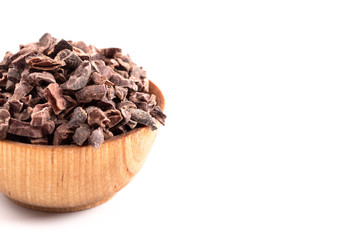 Bowl of Chocolate Nibs Isolated on a White Background