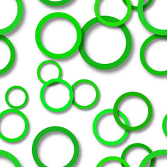 Abstract seamless pattern of randomly arranged green rings with soft shadows on white background