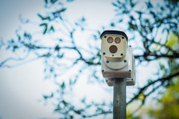 cctv camera on the pole in the park.