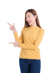 Beautiful asian woman smiling and pointing finger to copy space isolated over white background